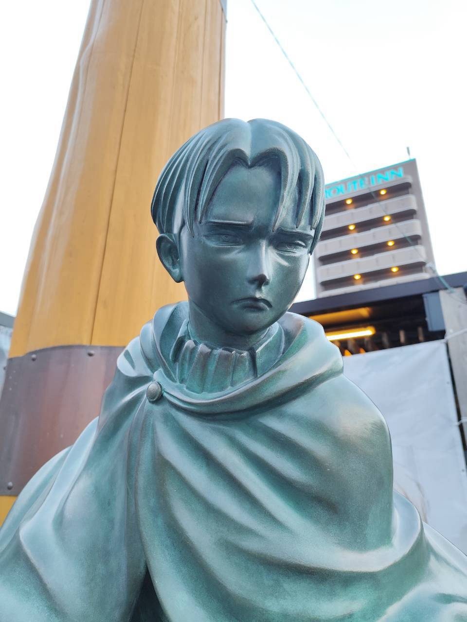 Face of the Levi Ackerman bronze statue at Hita Station