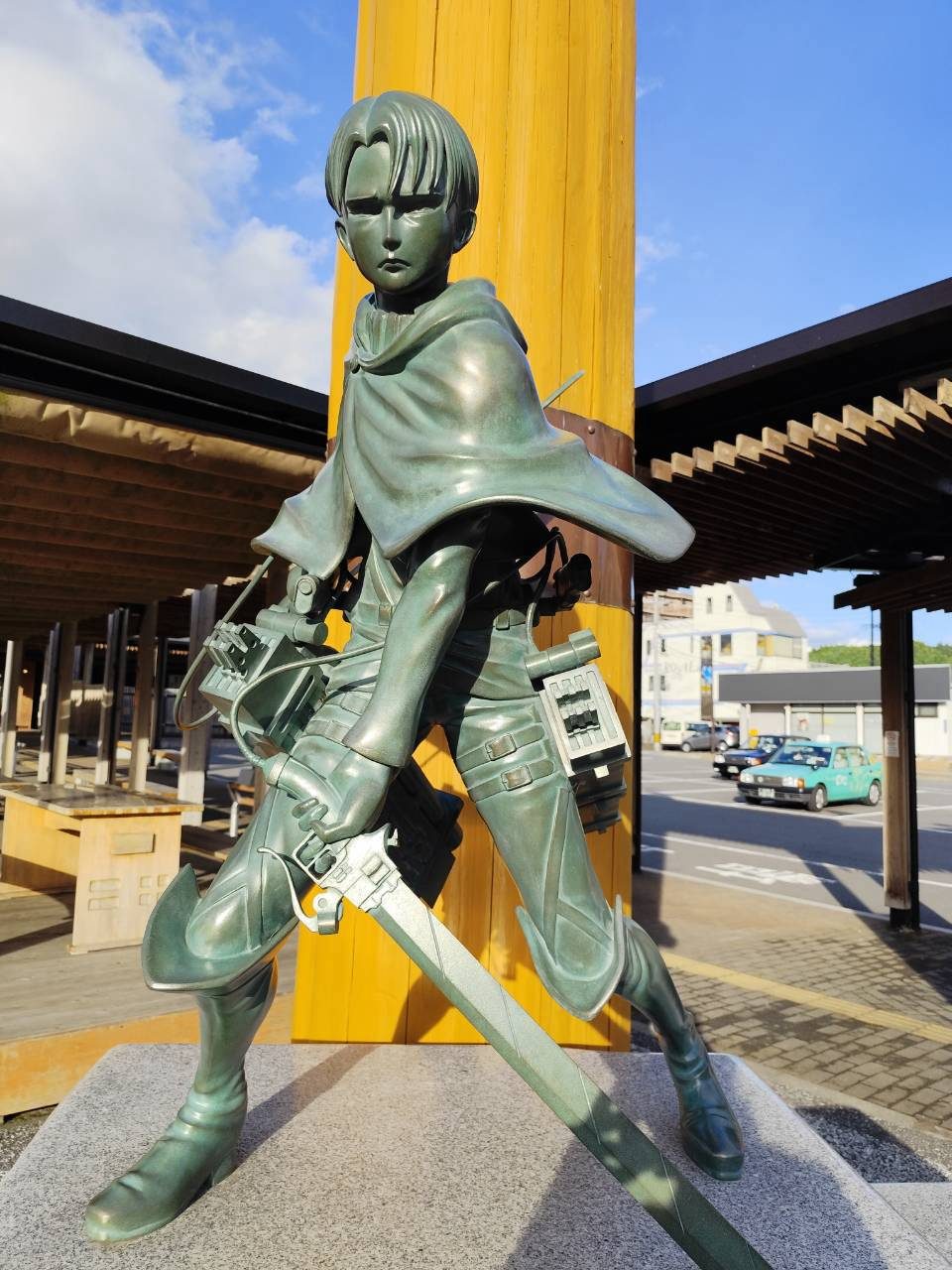 Levi Ackerman bronze statue in front of Hita Station